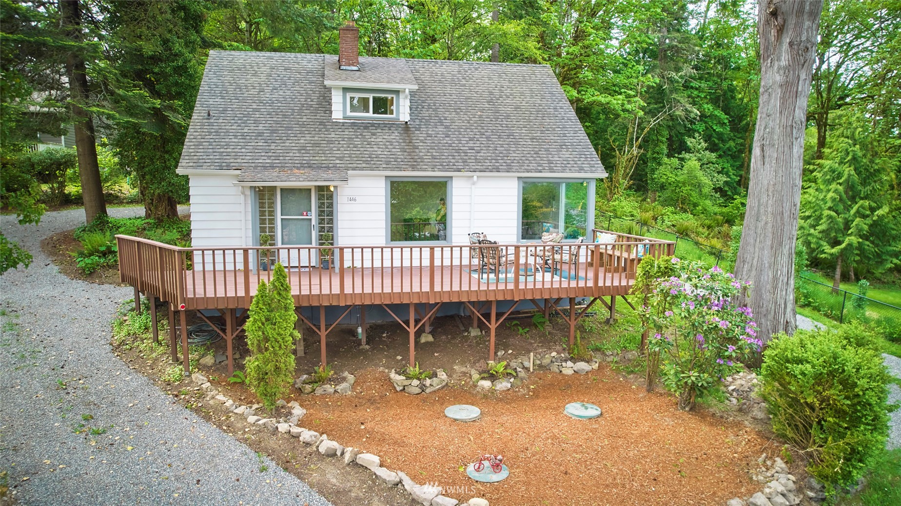 1446 Dogwood Hill Road Southwest Port Orchard, WA 98366 - Photo 8 of 31 a front view of a house with yard porch and furniture