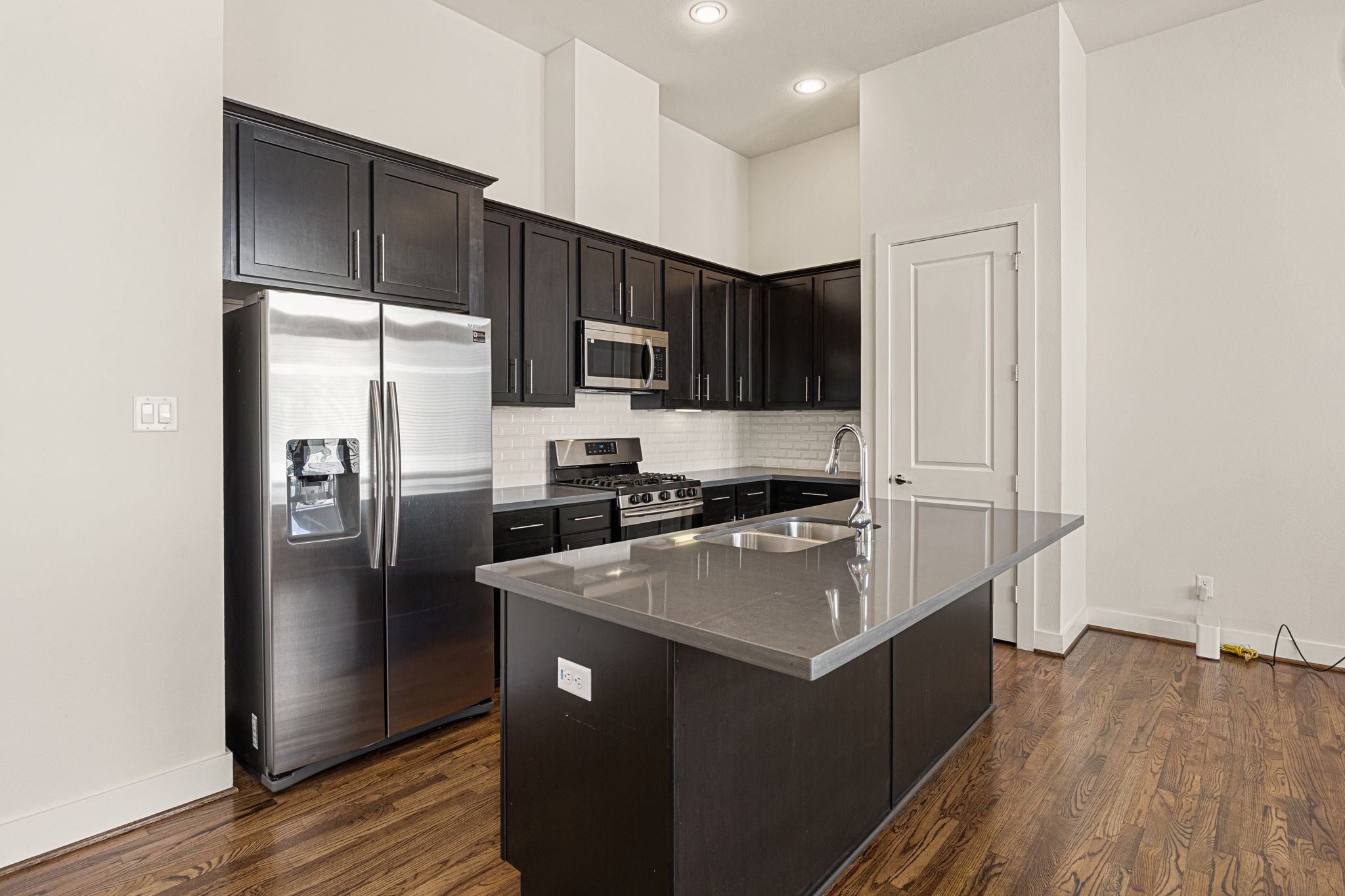 3945 Tulane Street Houston, TX 77018 - Photo 3 of 26 a kitchen with stainless steel appliances granite countertop a refrigerator a sink and a stove