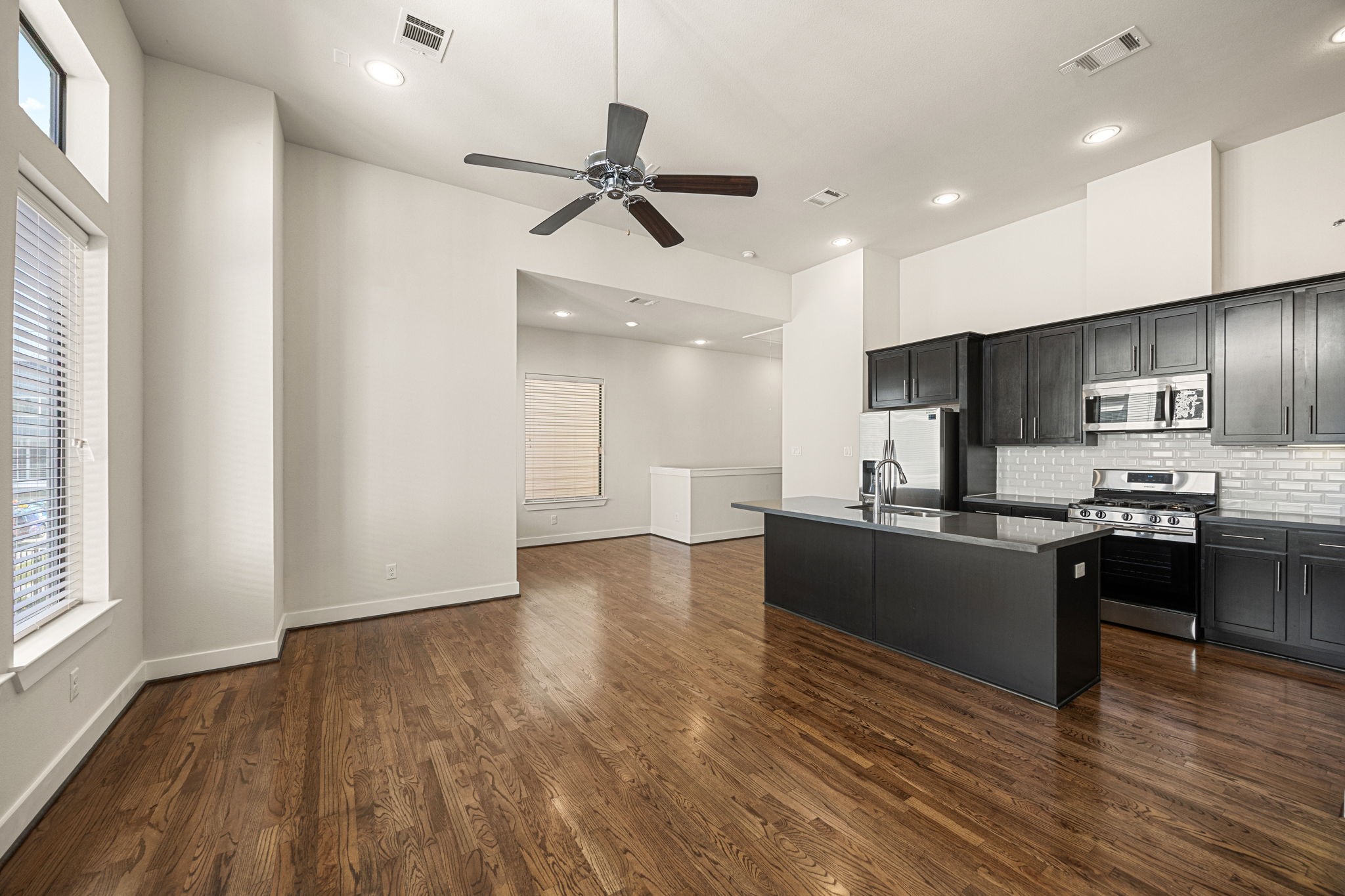 3945 Tulane Street Houston, TX 77018 - Photo 7 of 26 a large kitchen with stainless steel appliances kitchen island granite countertop a large counter top and stove