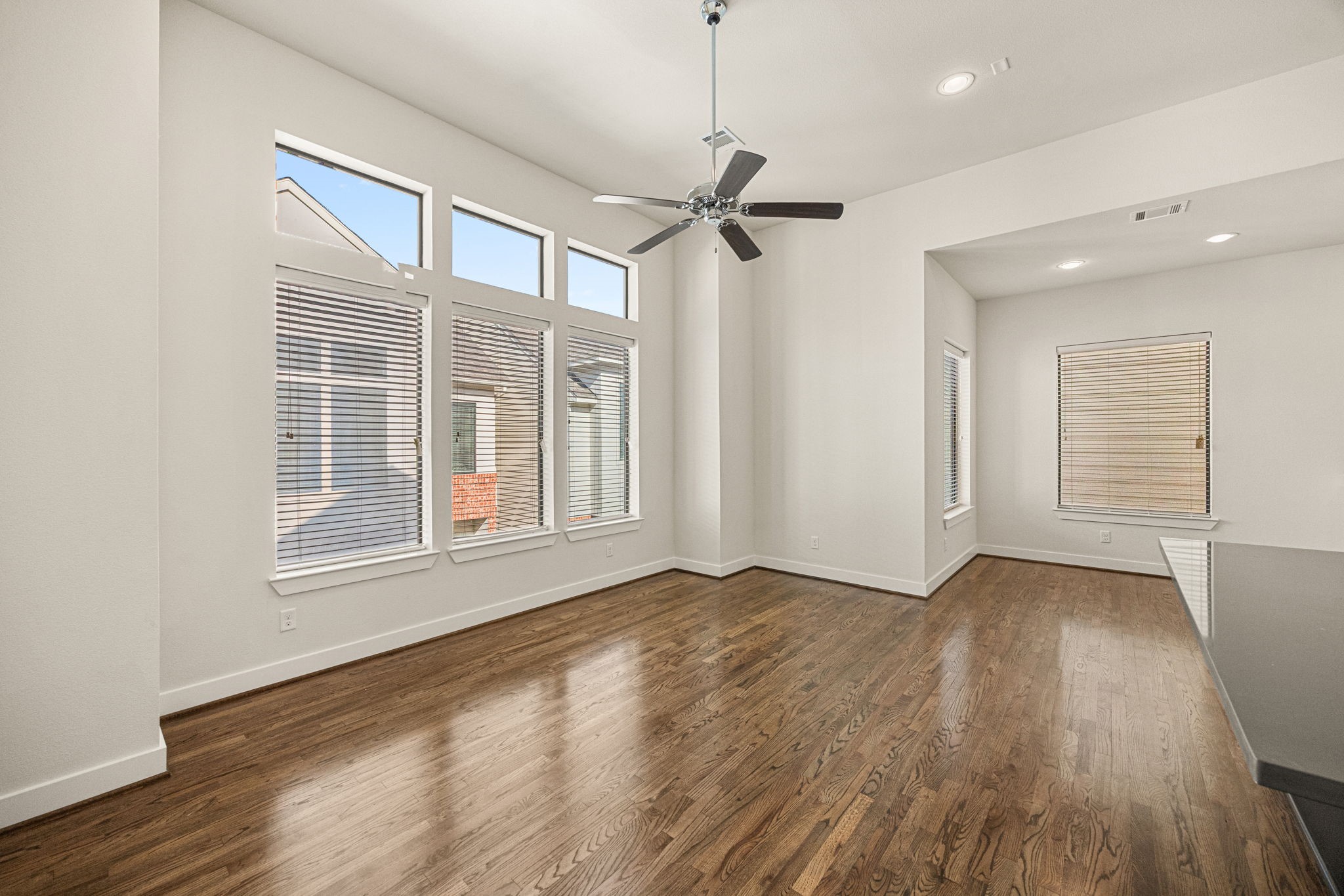 3945 Tulane Street Houston, TX 77018 - Photo 8 of 26 a view of empty room with wooden floor and fan