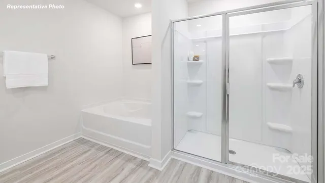 a bathroom with a bathtub and shower