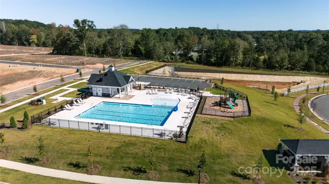 a view of a swimming pool with a yard