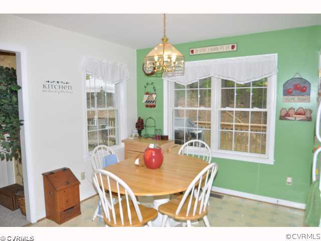 2525 Brookforest Road Midlothian, VA 23112 - Photo 3 of 11 a view of a dining room with furniture window and outside view