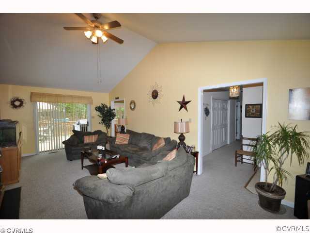 2525 Brookforest Road Midlothian, VA 23112 - Photo 4 of 11 a living room with furniture potted plant and a chandelier