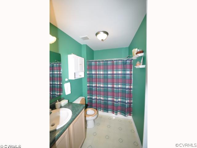 2525 Brookforest Road Midlothian, VA 23112 - Photo 5 of 11 a bathroom with a sink toilet and shower