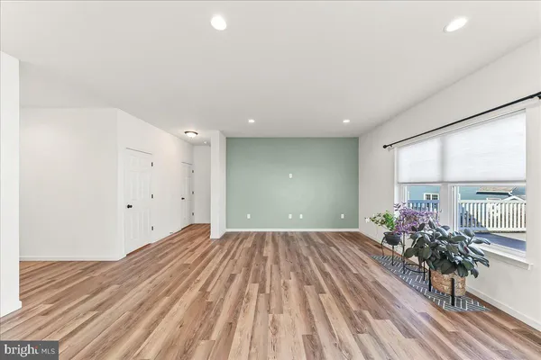 wooden floor in a room with a window