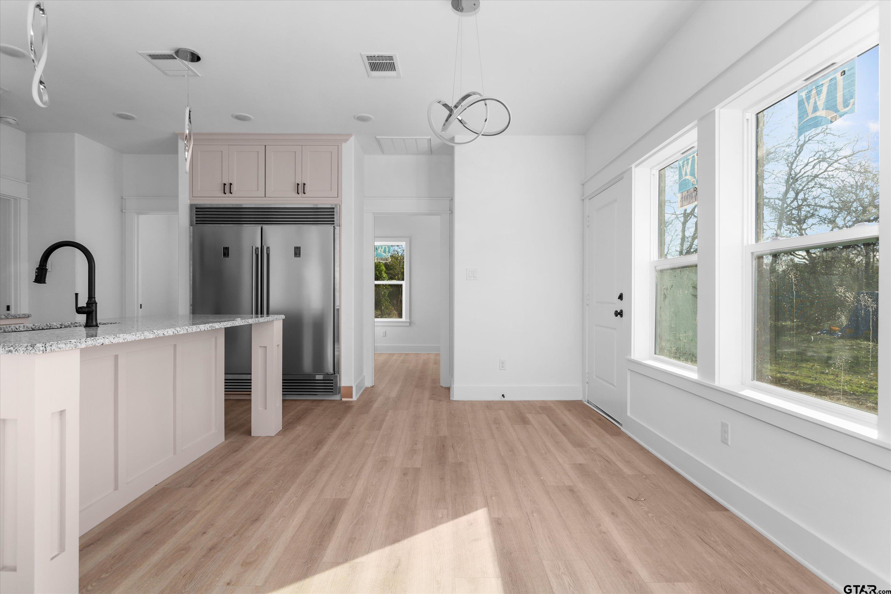 3026 Rose Tyler, TX 75701 - Photo 15 of 25 a view of a kitchen with wooden floor and a window
