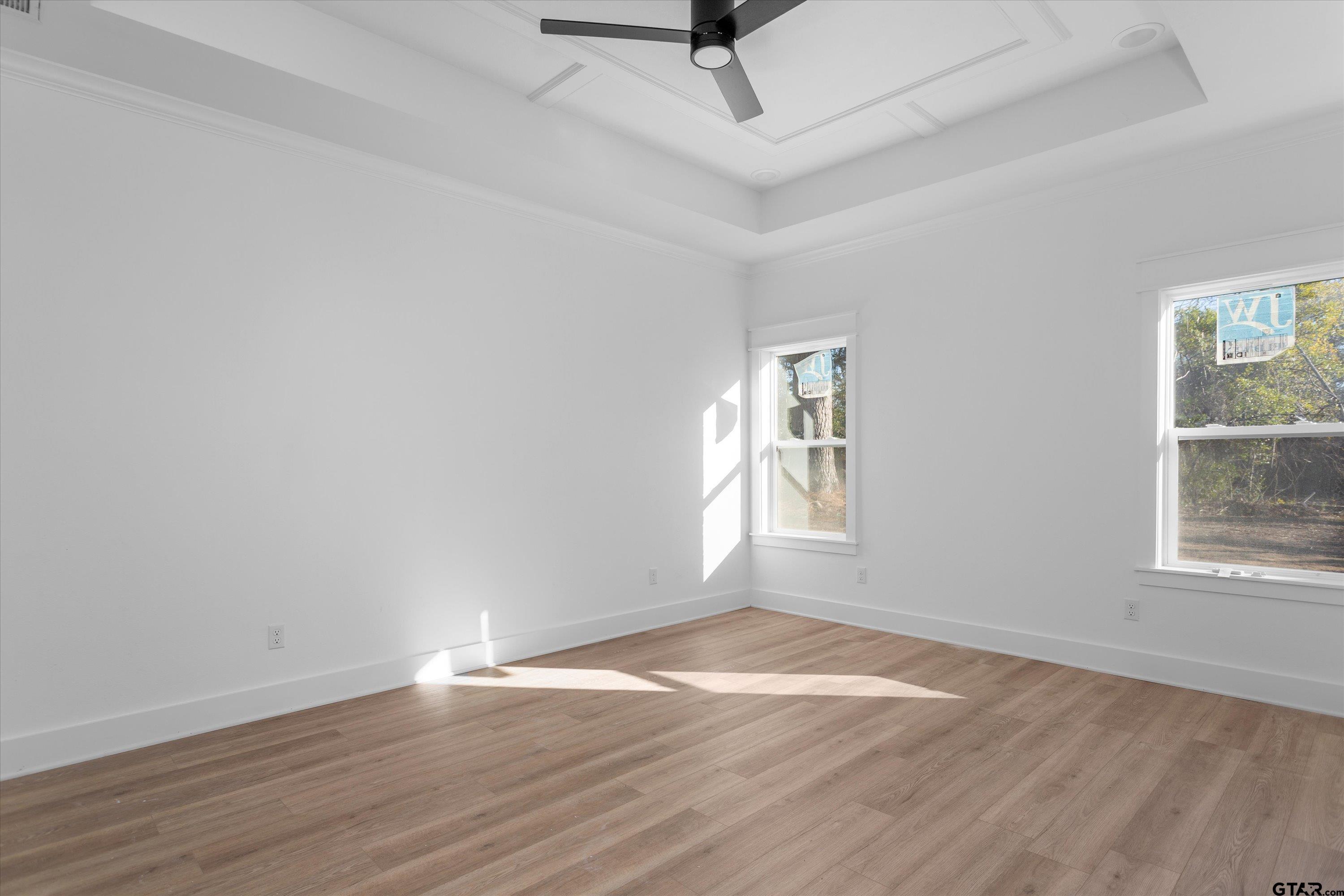 3026 Rose Tyler, TX 75701 - Photo 16 of 25 an empty room with wooden floor fan and windows