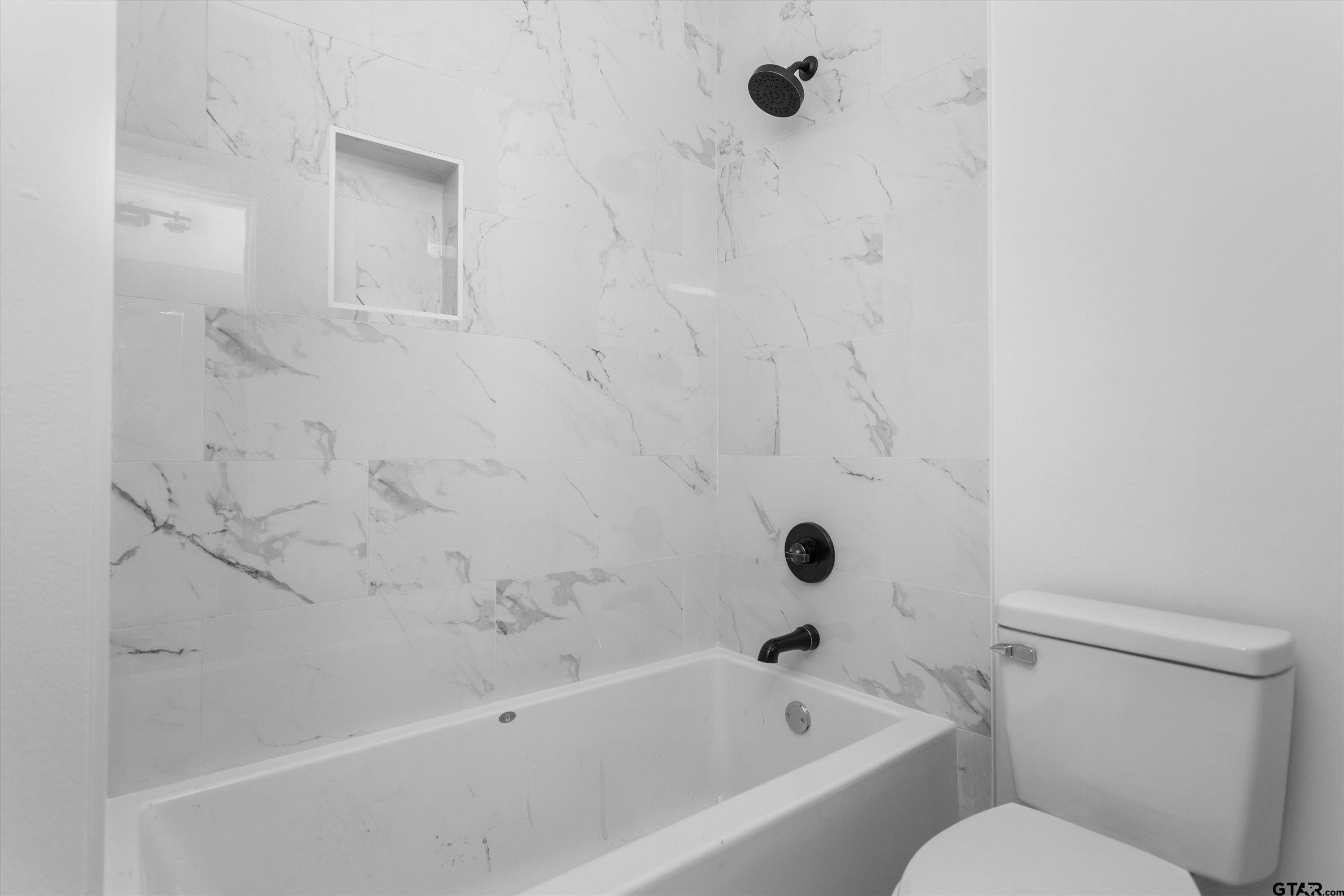 3026 Rose Tyler, TX 75701 - Photo 18 of 25 a bathroom with a bathtub