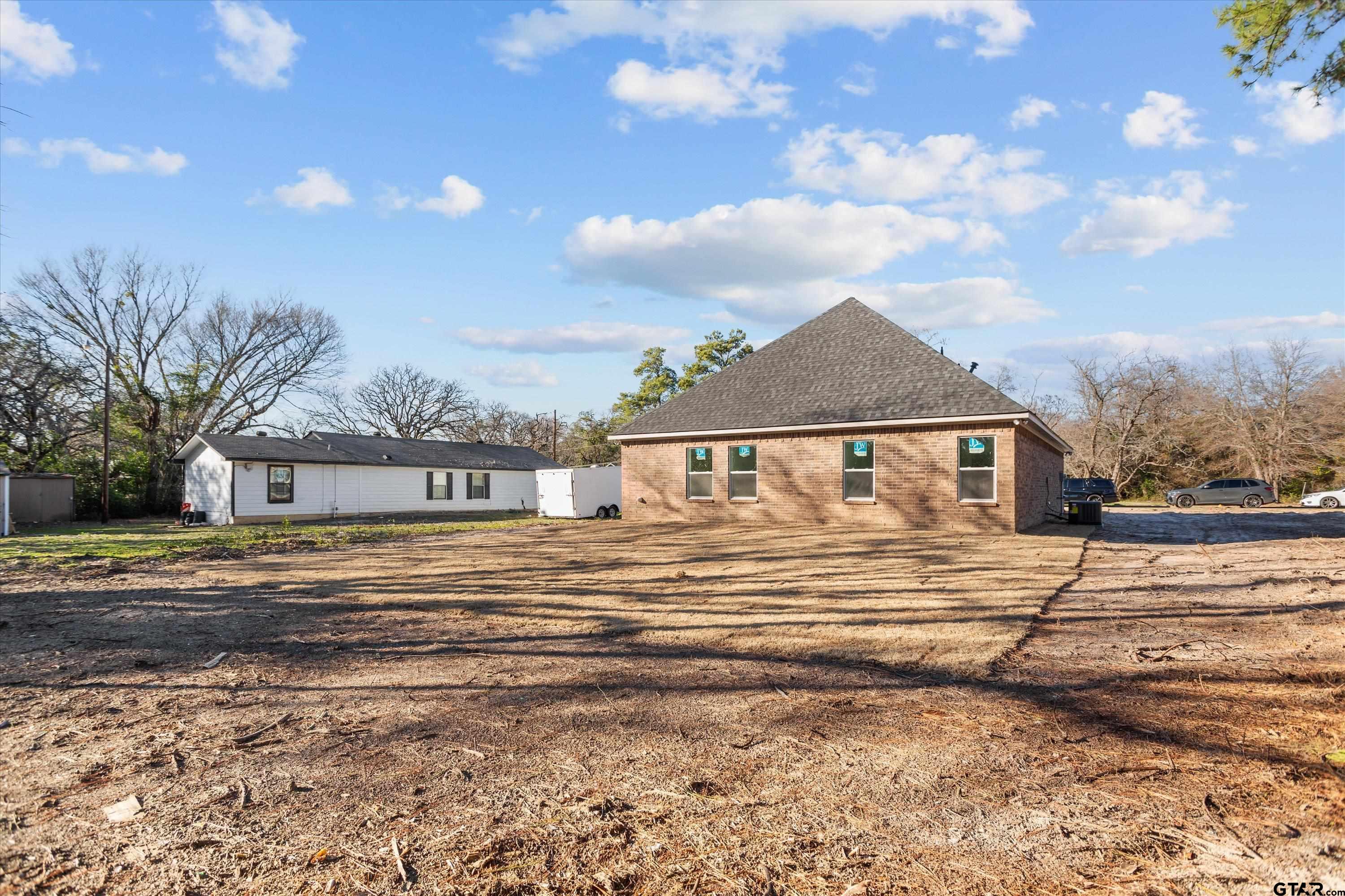 3026 Rose Tyler, TX 75701 - Photo 25 of 25 a front view of a house with a yard