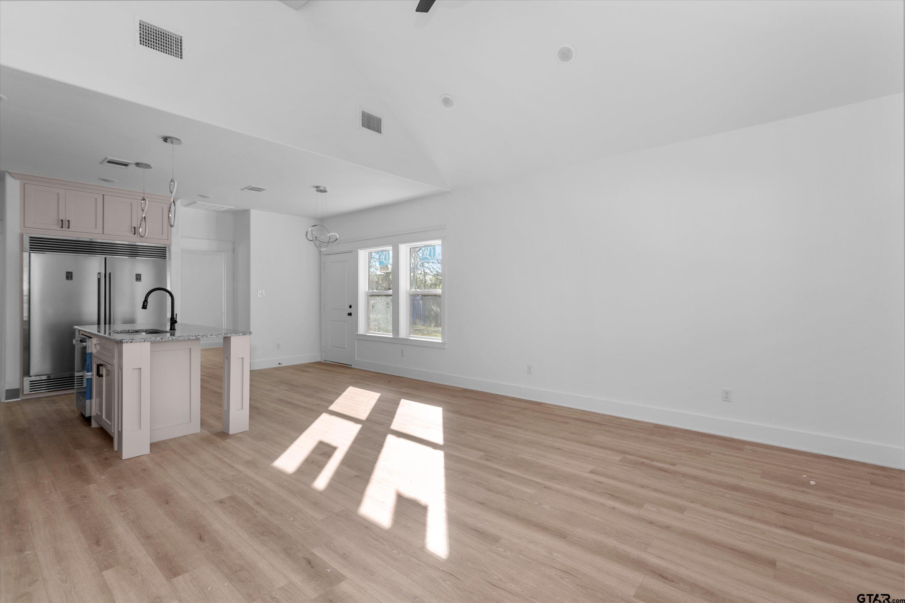 3026 Rose Tyler, TX 75701 - Photo 5 of 25 a view of empty room with wooden floor and window