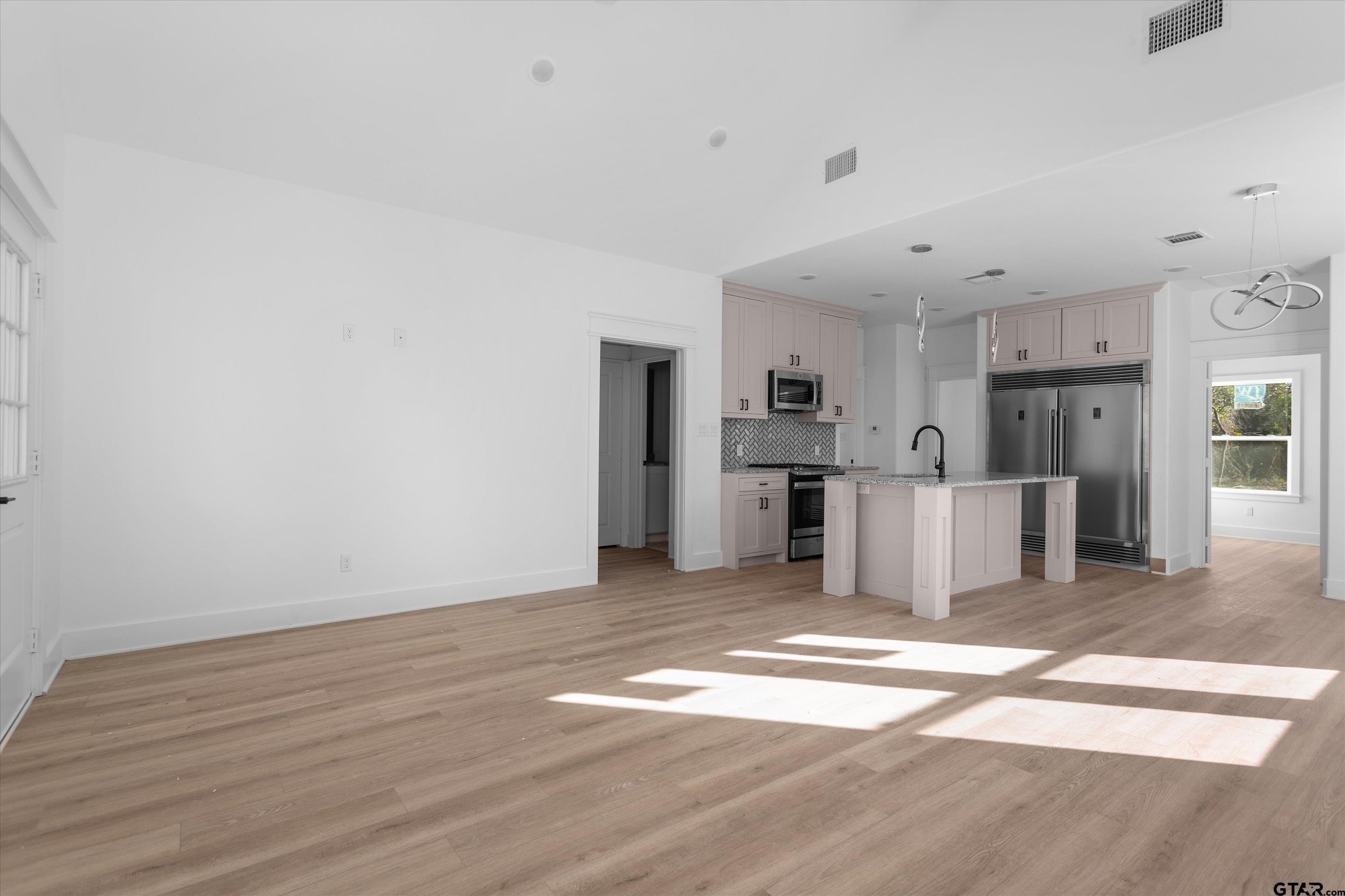 3026 Rose Tyler, TX 75701 - Photo 7 of 25 a view of a kitchen with wooden floor