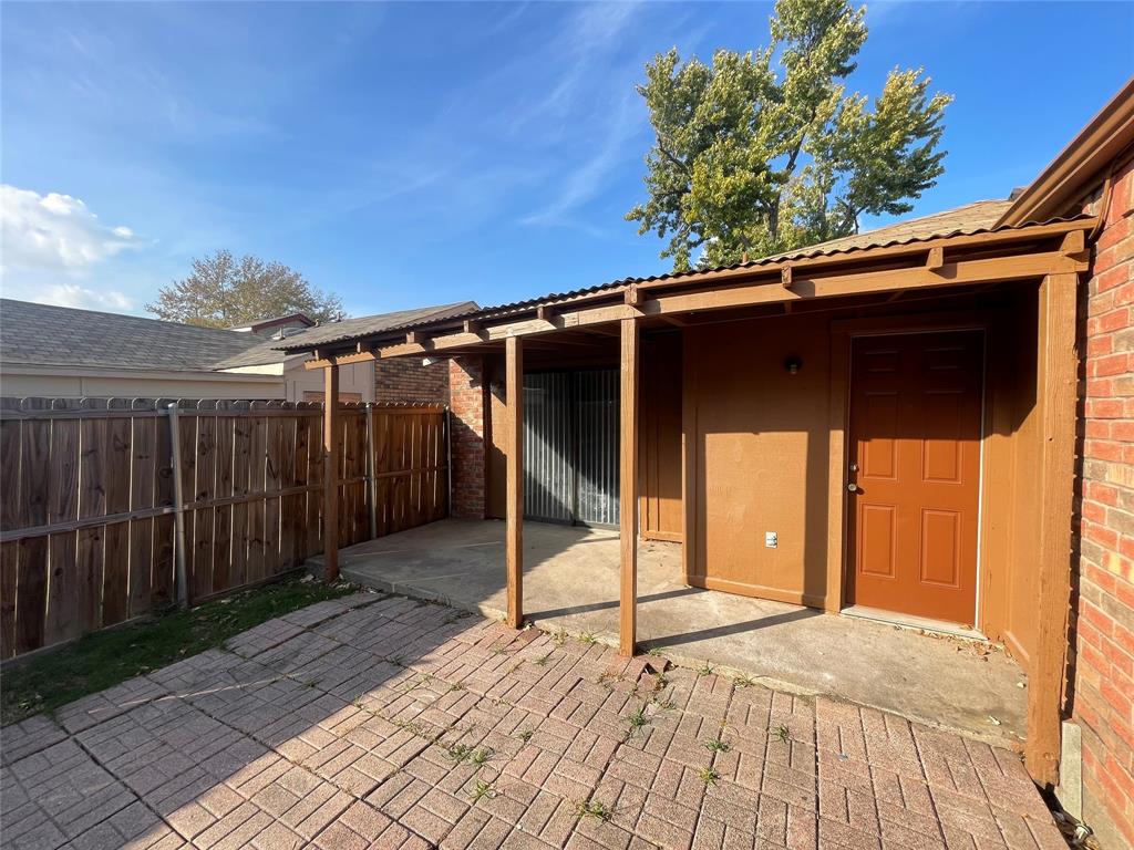 226 Wilderness Trail Mesquite, TX 75149 - Photo 11 of 12 a backyard of a house with table and chairs