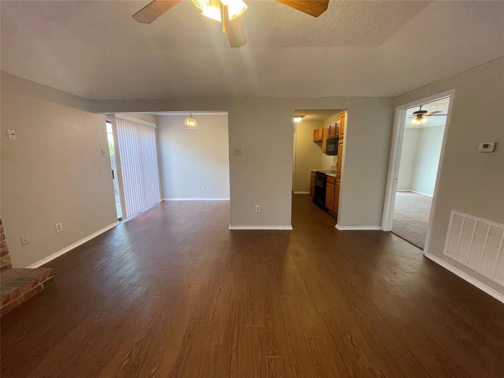 226 Wilderness Trail Mesquite, TX 75149 - Photo 2 of 12 a view of a livingroom with wooden floor