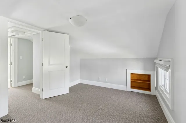 a view of an empty room and closet