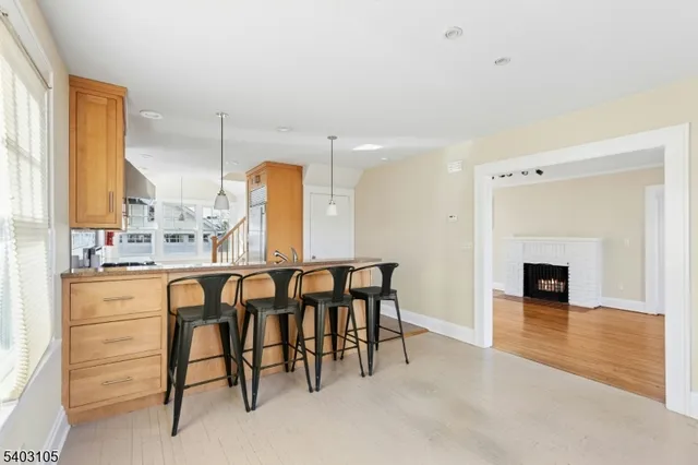 a dining room with furniture and a fireplace