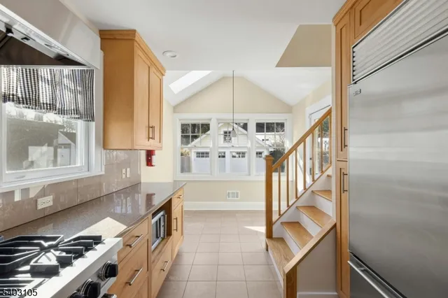 a kitchen with granite countertop a stove and a sink