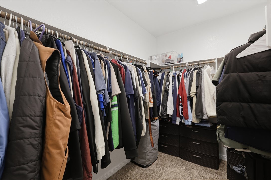 2725 Porter's Way Bryan, TX 77803 - Photo 14 of 19 a view of walk in closet with clothes