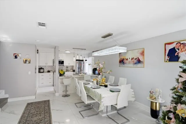 a living room with furniture and a entryway