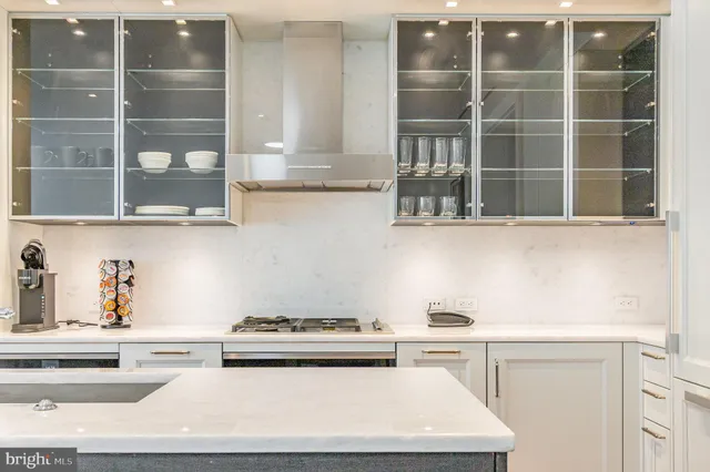a white stove top oven sitting inside of a kitchen