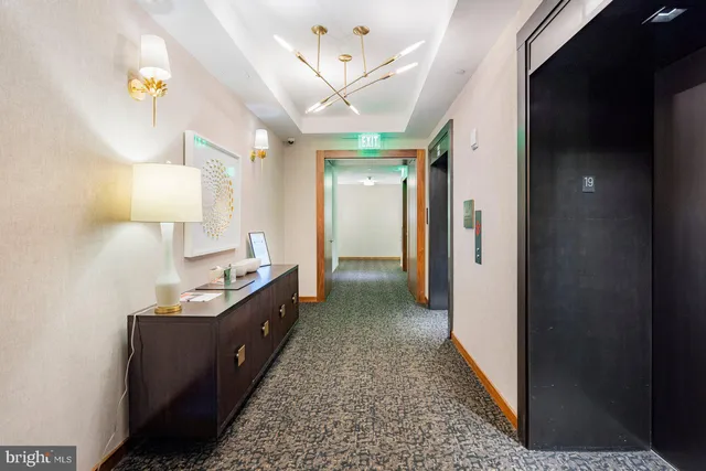 a large bathroom with a tub sink and a mirror