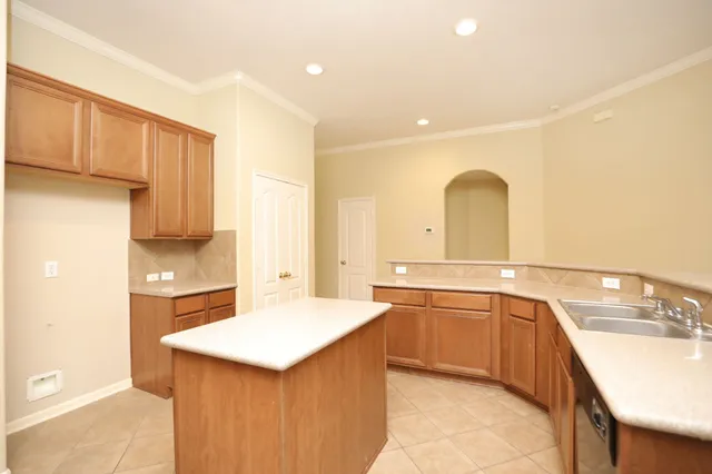 a kitchen with a sink and cabinets