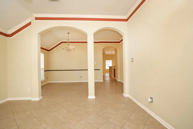 a view of a livingroom with wooden floor and a glass door