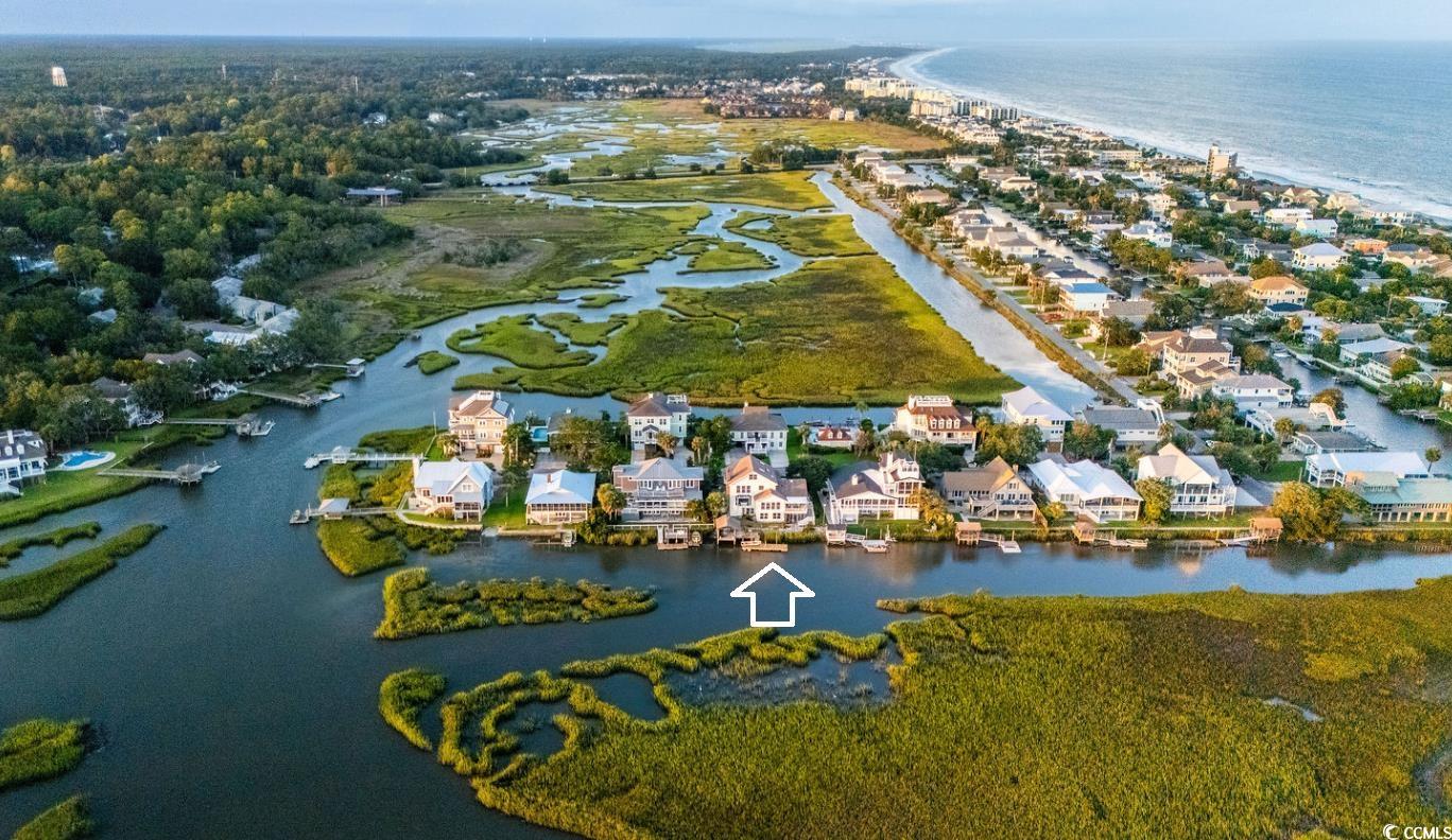 75 Marsh Hen Drive Pawleys Island, SC 29585 - Photo 13 of 26 Aerial overview of property's location with a large body of water and nearby suburban area