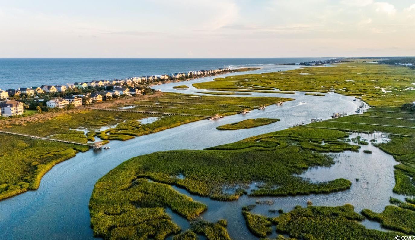 75 Marsh Hen Drive Pawleys Island, SC 29585 - Photo 14 of 26 Aerial view of property and surrounding area with a nearby body of water