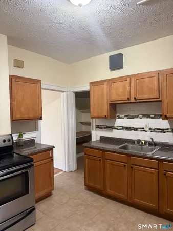 a kitchen with stainless steel appliances a stove and a refrigerator