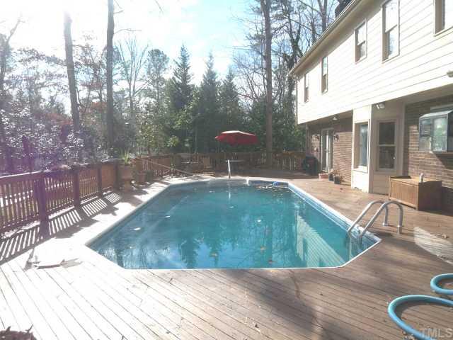 11605 Appaloosa Run West Raleigh, NC 27613 - Photo 8 of 12 a swimming pool with outdoor seating and yard