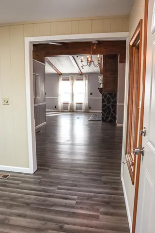 a view of interior space with wooden floor and stairs