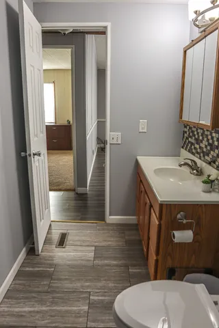 a bathroom with a sink toilet and shower