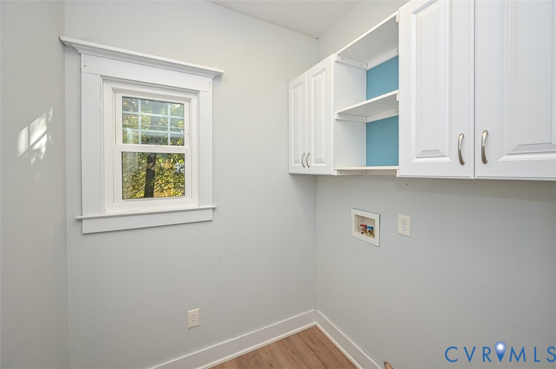 337 Shelton Place Aylett, VA 23009 - Photo 31 of 40 Laundry room with LVP flooring, cabinet space, and