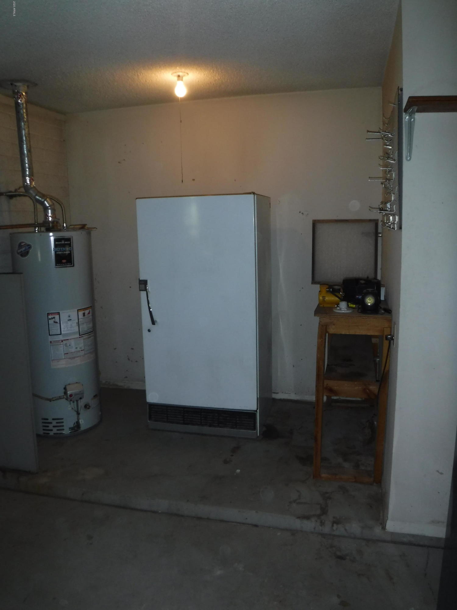 3117 West Calavar Road Phoenix, AZ 85053 - Photo 32 of 33 garage has work area