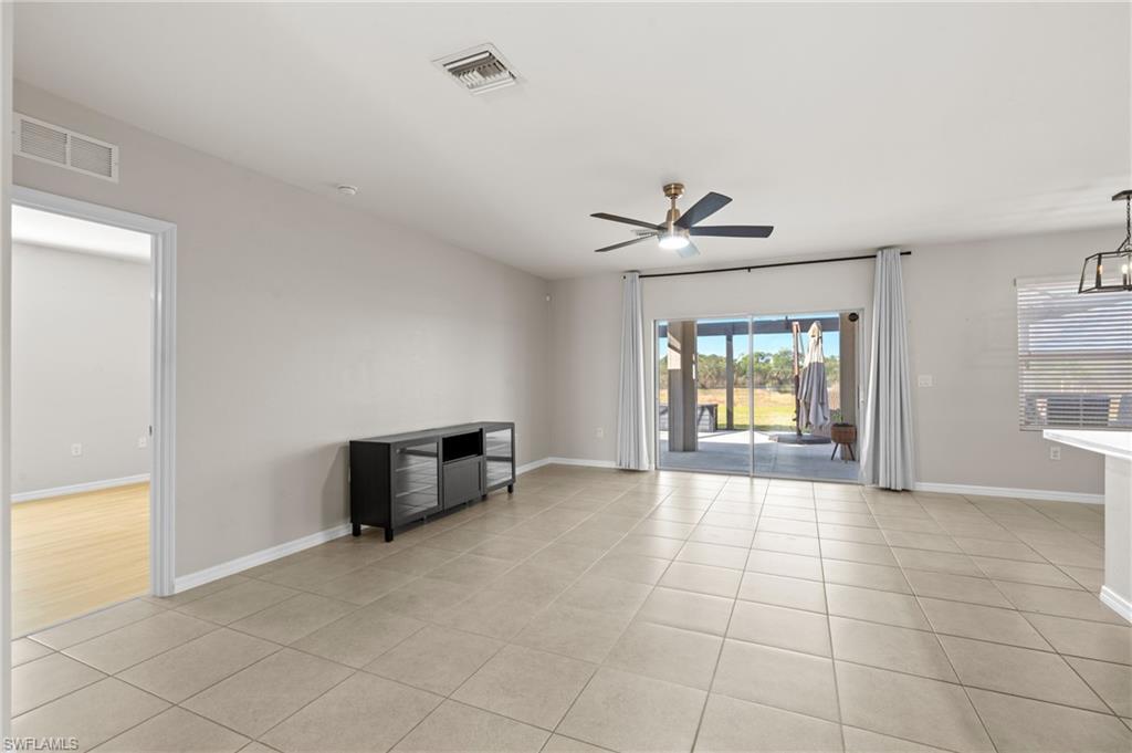 8149 Gopher Tortoise Trail Lehigh Acres, FL 33972 - Photo 11 of 50 a view of an empty room with a window