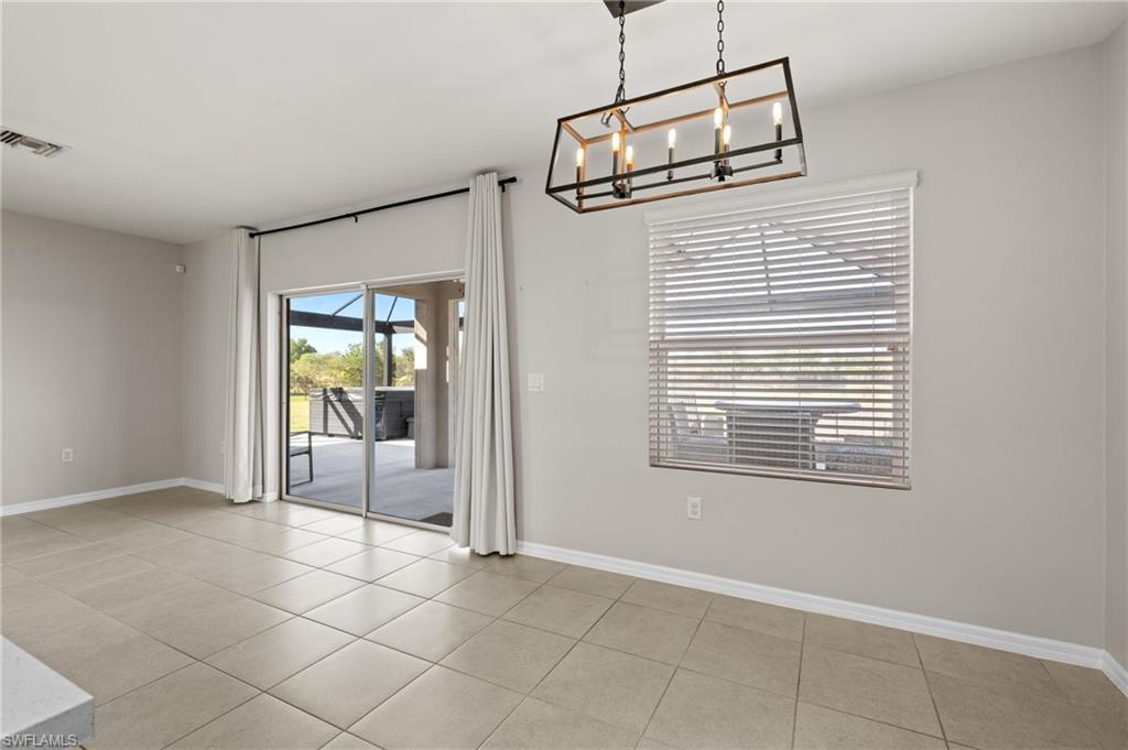 8149 Gopher Tortoise Trail Lehigh Acres, FL 33972 - Photo 13 of 50 a view of an empty room with a window