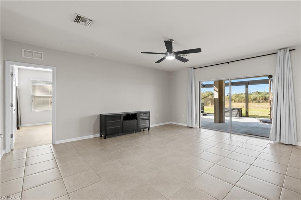 8149 Gopher Tortoise Trail Lehigh Acres, FL 33972 - Photo 18 of 50 a view of an empty room with a window