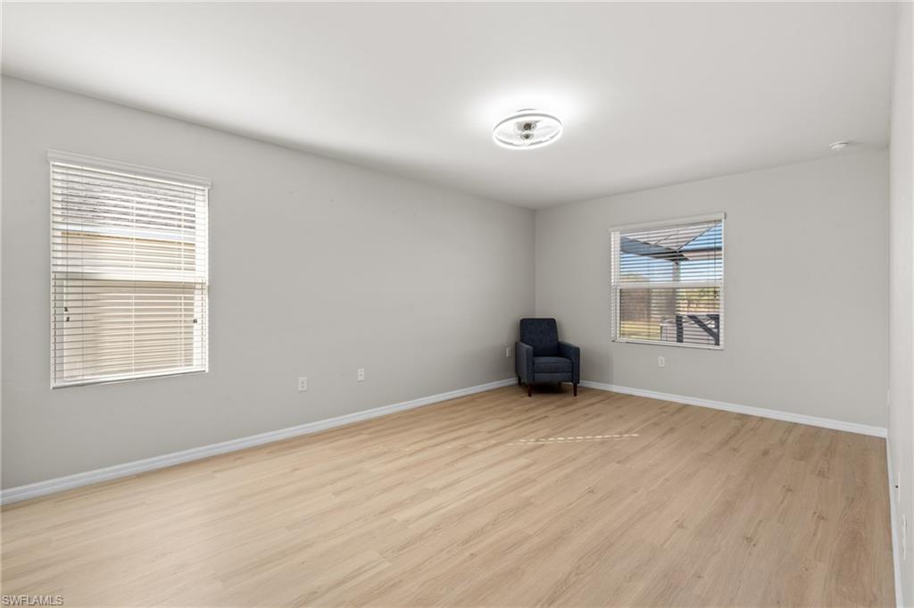 8149 Gopher Tortoise Trail Lehigh Acres, FL 33972 - Photo 28 of 50 an empty room with windows