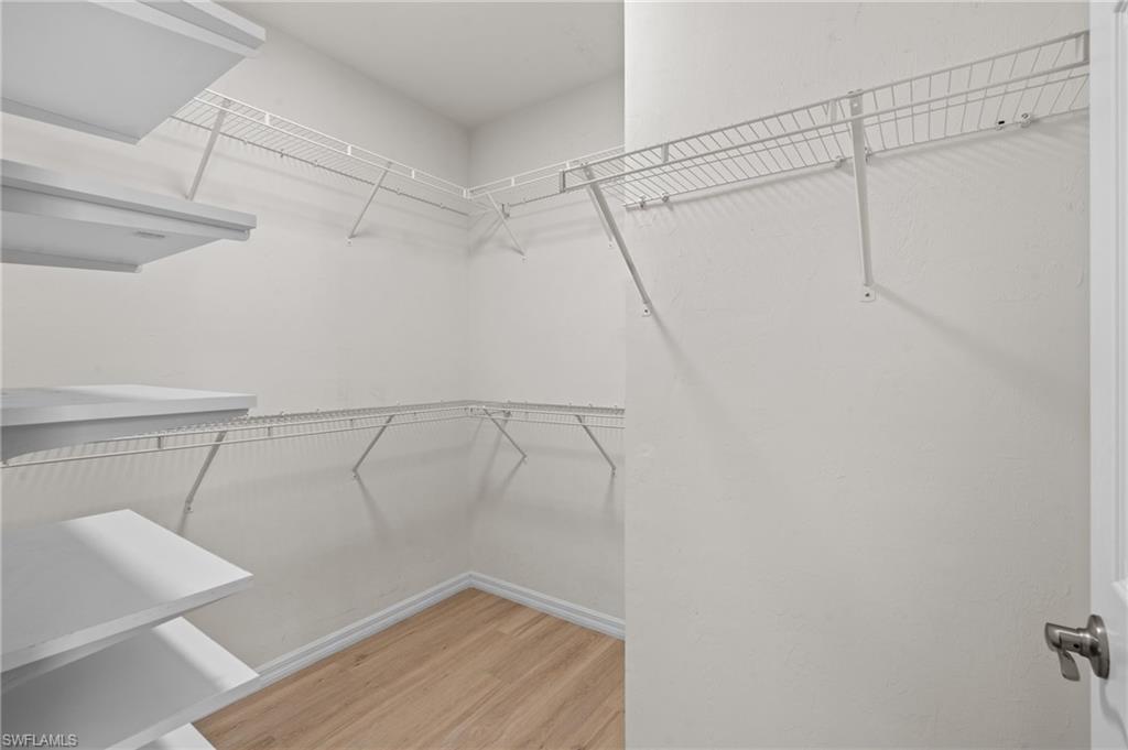 8149 Gopher Tortoise Trail Lehigh Acres, FL 33972 - Photo 31 of 50 a view of a room with racks on the wall