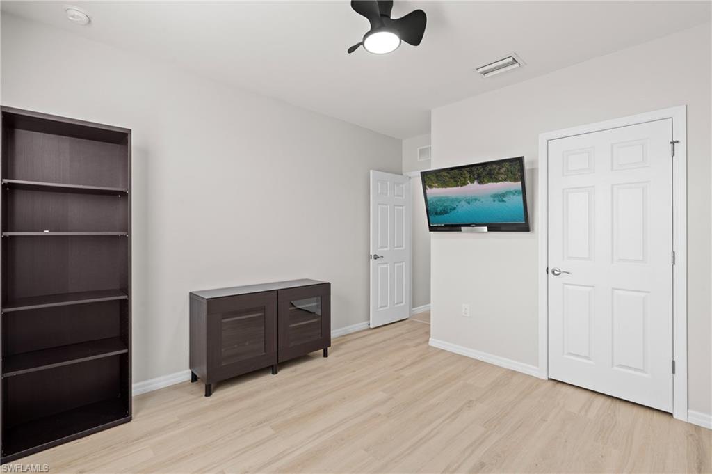 8149 Gopher Tortoise Trail Lehigh Acres, FL 33972 - Photo 34 of 50 a view of a livingroom with wooden floor
