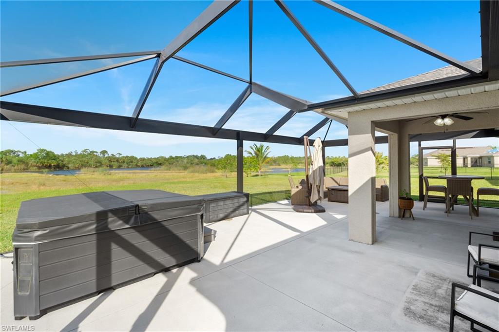8149 Gopher Tortoise Trail Lehigh Acres, FL 33972 - Photo 40 of 50 a view of a patio with swimming pool