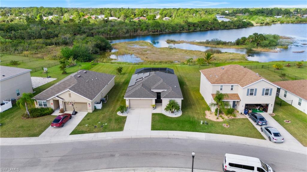 8149 Gopher Tortoise Trail Lehigh Acres, FL 33972 - Photo 44 of 50 an aerial view of house with yard swimming pool and outdoor seating