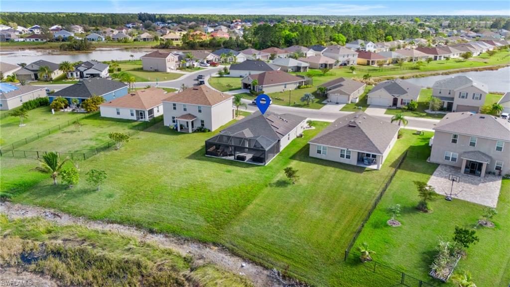 8149 Gopher Tortoise Trail Lehigh Acres, FL 33972 - Photo 45 of 50 an aerial view of a house with a garden