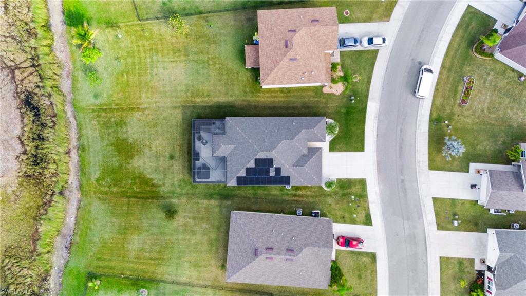 8149 Gopher Tortoise Trail Lehigh Acres, FL 33972 - Photo 50 of 50 an aerial view of residential house with outdoor space and parking