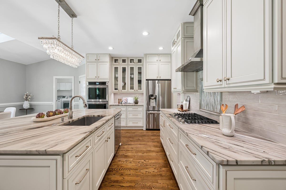 1008 Broken Sound Way Raleigh, NC 27614 - Photo 15 of 51 Kitchen features large island with cabinets front back and side.