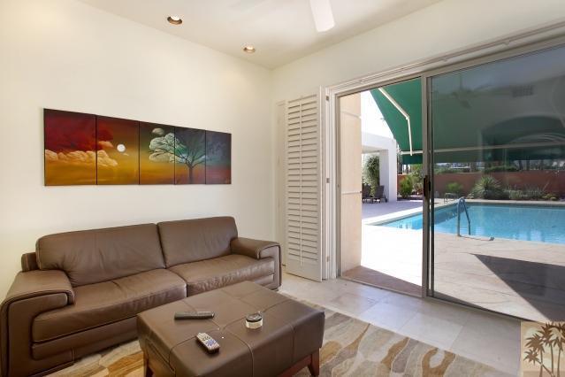 37232 Palm View Road Rancho Mirage, CA 92270 - Photo 12 of 25 a living room with furniture and a flat screen tv