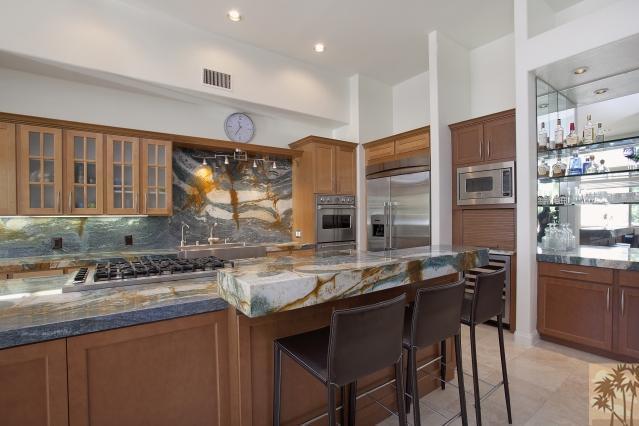 37232 Palm View Road Rancho Mirage, CA 92270 - Photo 13 of 25 a kitchen with granite countertop a sink and cabinets