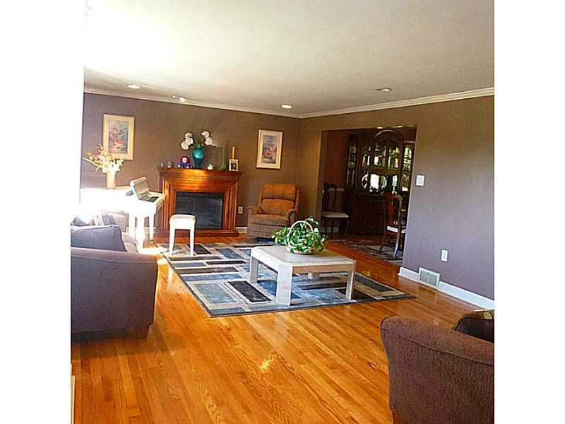 216 Tech Road Thornburg, PA 15205 - Photo 5 of 24 Living Room. Hardwood floors, recessed lights and decorative fireplace