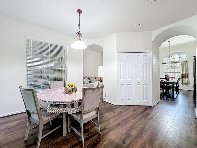 a kitchen with stainless steel appliances granite countertop a sink a stove and a refrigerator